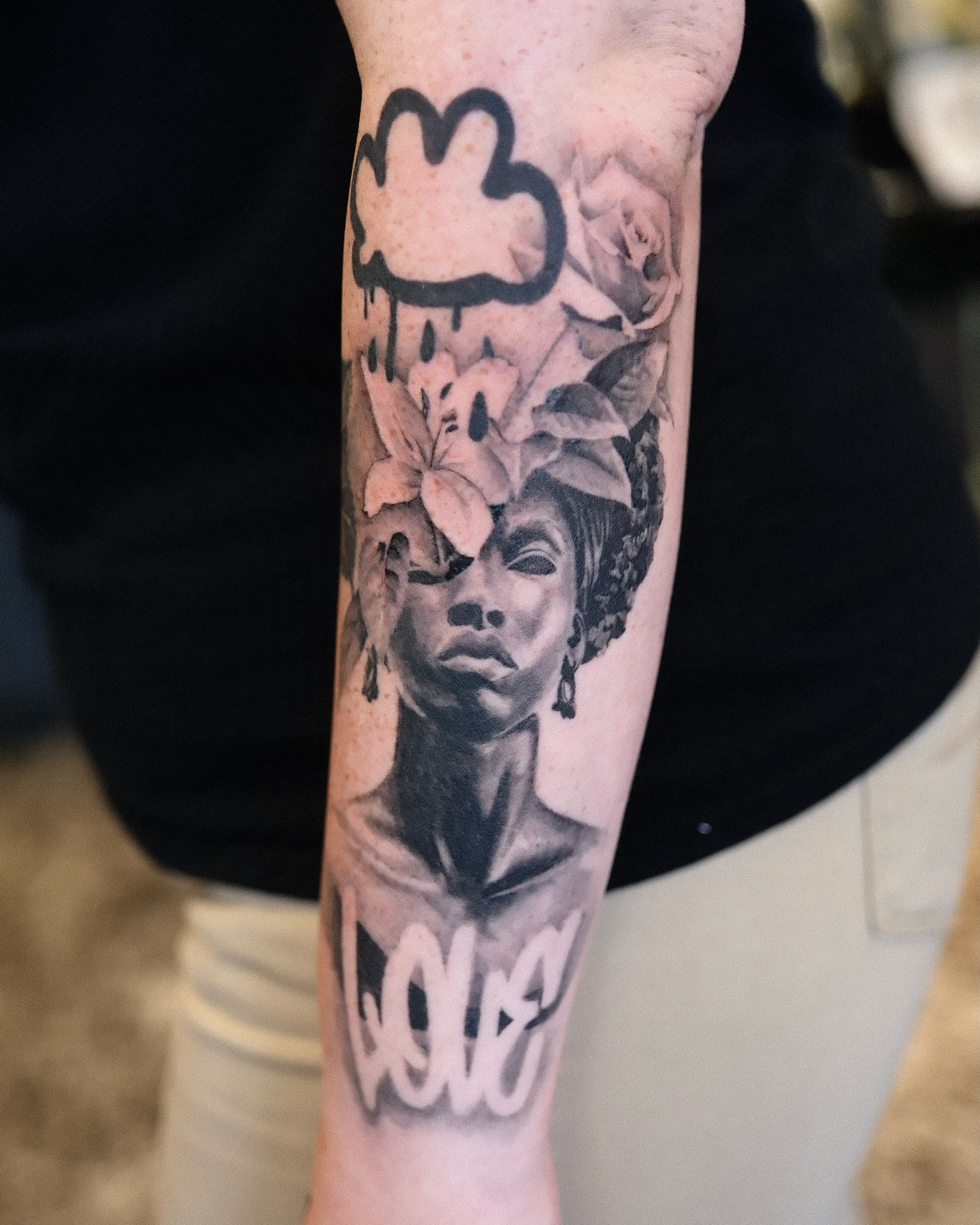 Woman with flowers realism tattoo on the forearm by Joel: Boston Tattoo Artist, Boston, Massachusetts