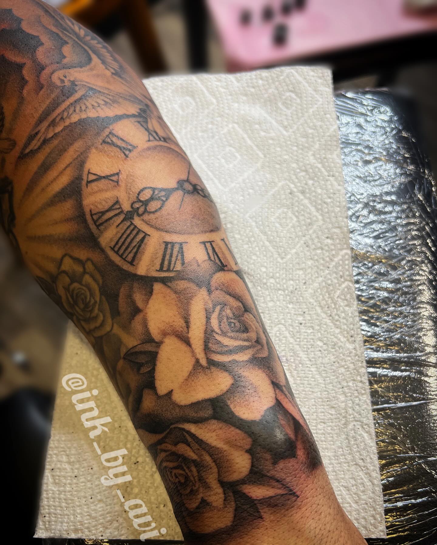 Clock and roses realism tattoo on the forearm by Avi, Cleveland, Ohio