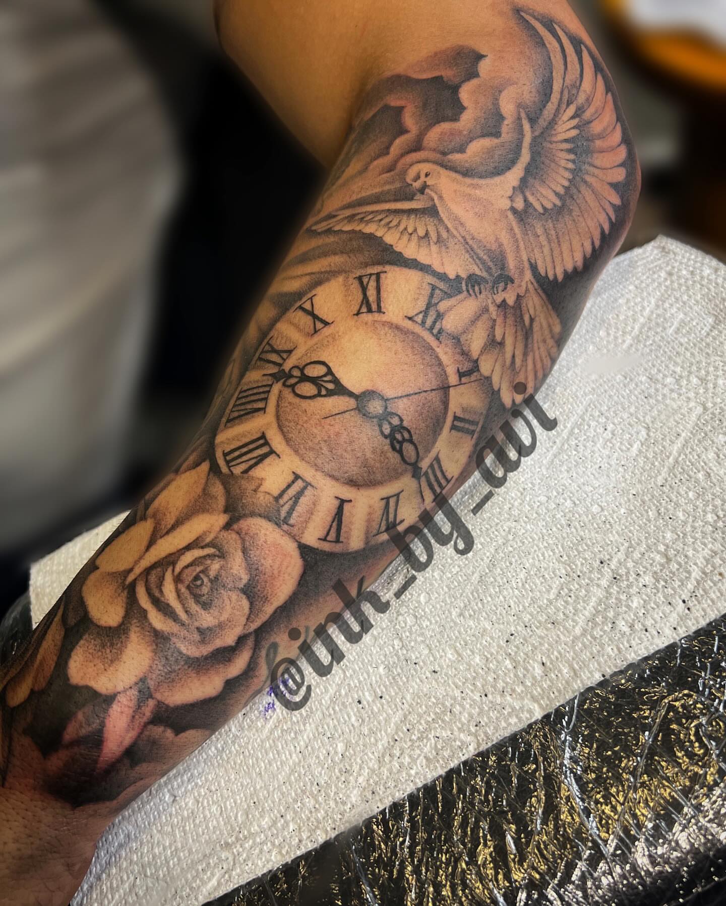 Clock and dove realism tattoo on the forearm by Avi, Cleveland, Ohio