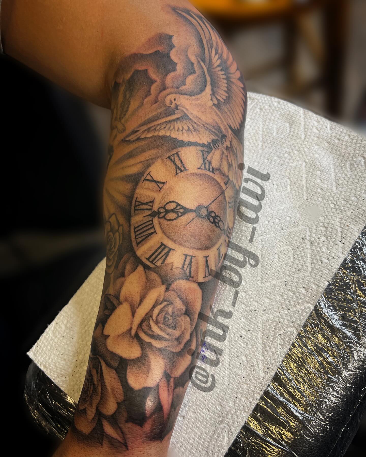 Clock and roses realism tattoo on the forearm by Avi, Cleveland, Ohio