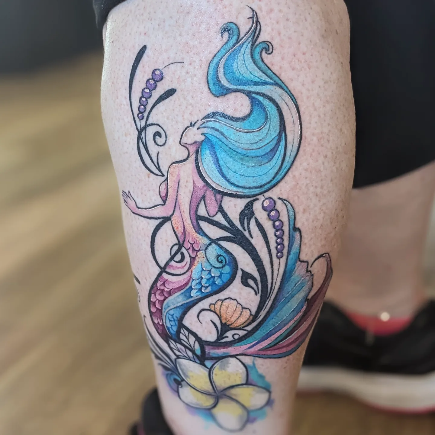 Mermaid and fish new school tattoo on the calf by Lizzy Smith, Leander, Texas
