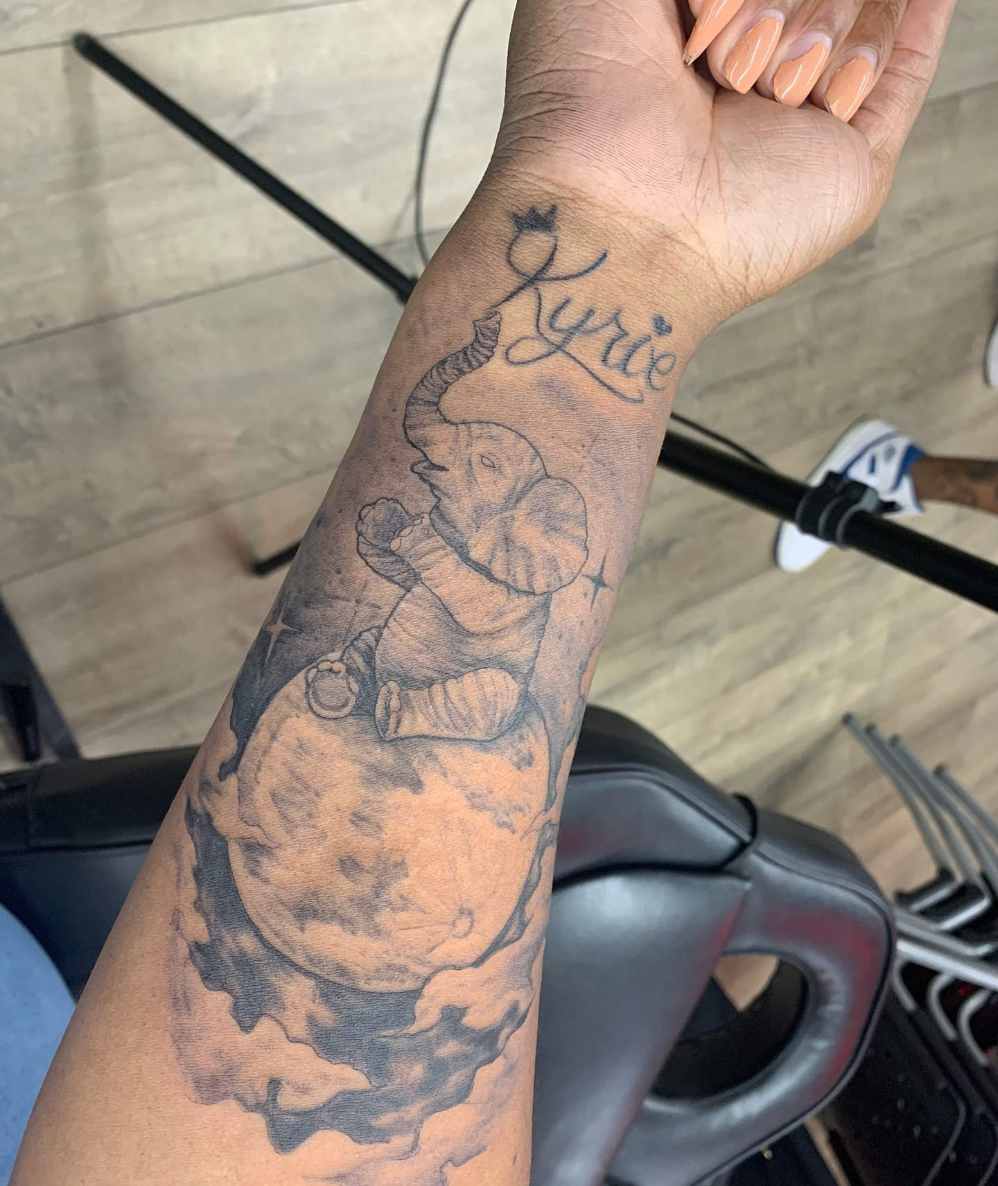 Elephant on moon black and grey tattoo on the forearm by @cvpital