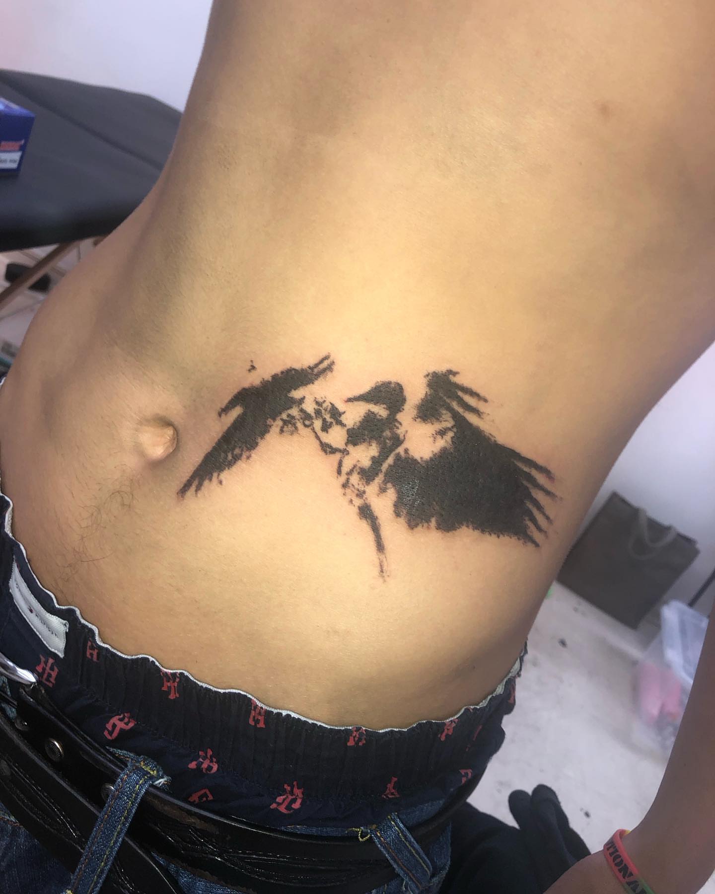 Horse and rider black and grey tattoo on the ribs by @emotionalthugtattoo