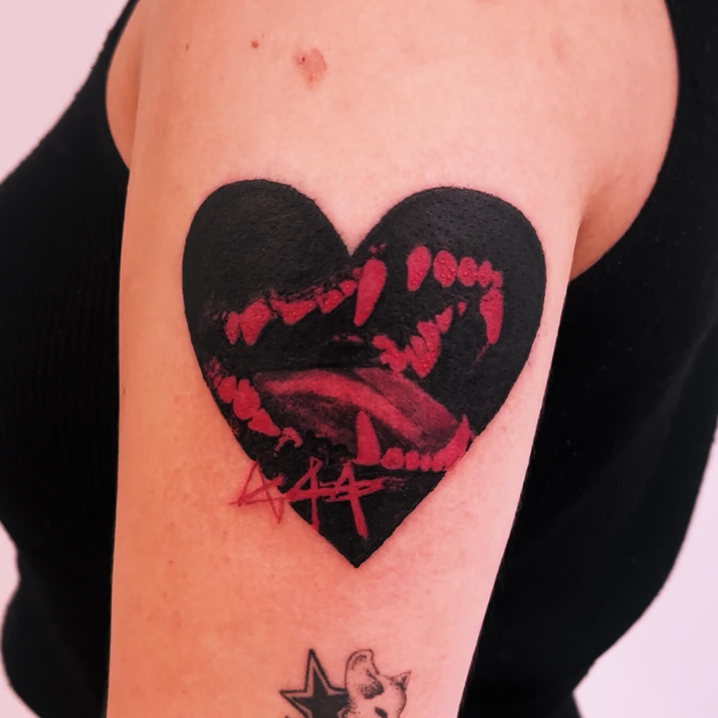 Heart blackwork tattoo on the forearm by Bennie Bae