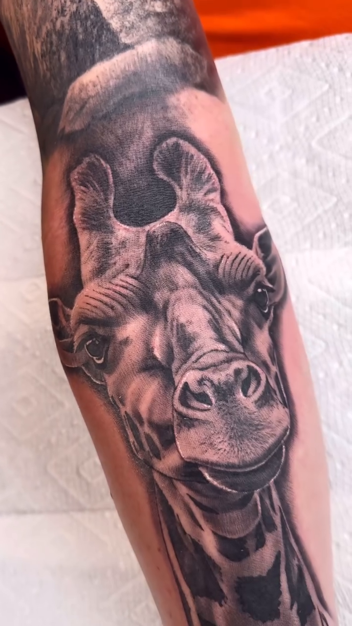 Tattoo by @brycemoodietattoo — realism, black_and_grey