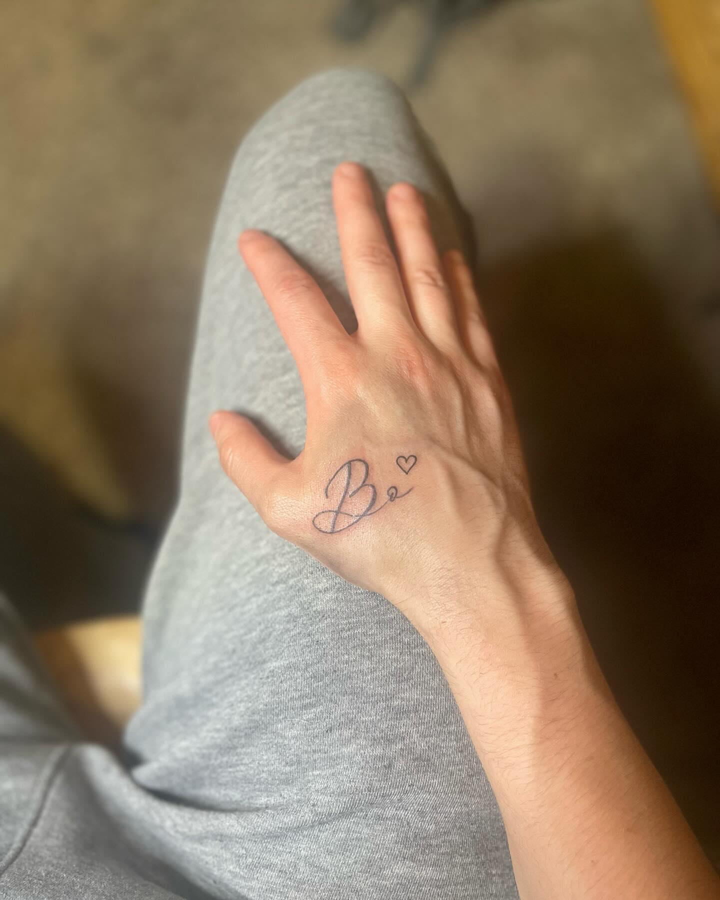 Be lettering script tattoo on the hand by Danny Garcia