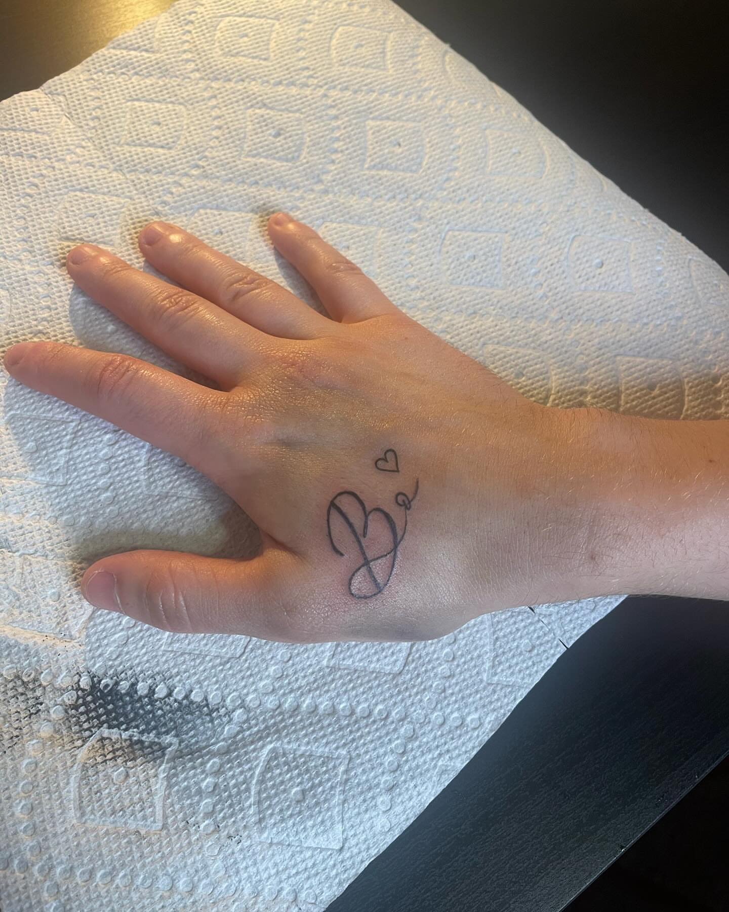 Script lettering lettering script tattoo on the hand by Danny Garcia