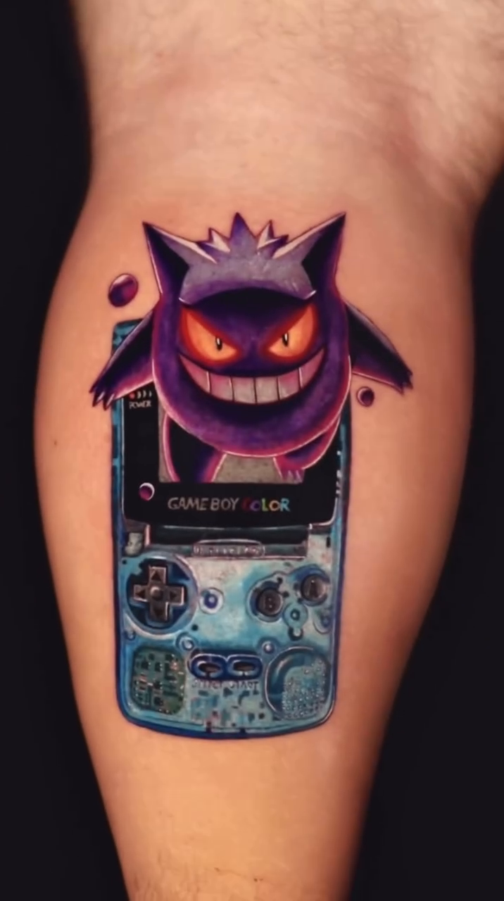 Gengar on a Game Boy Color anime tattoo by Binn Binn - Houston Tattoo Artist