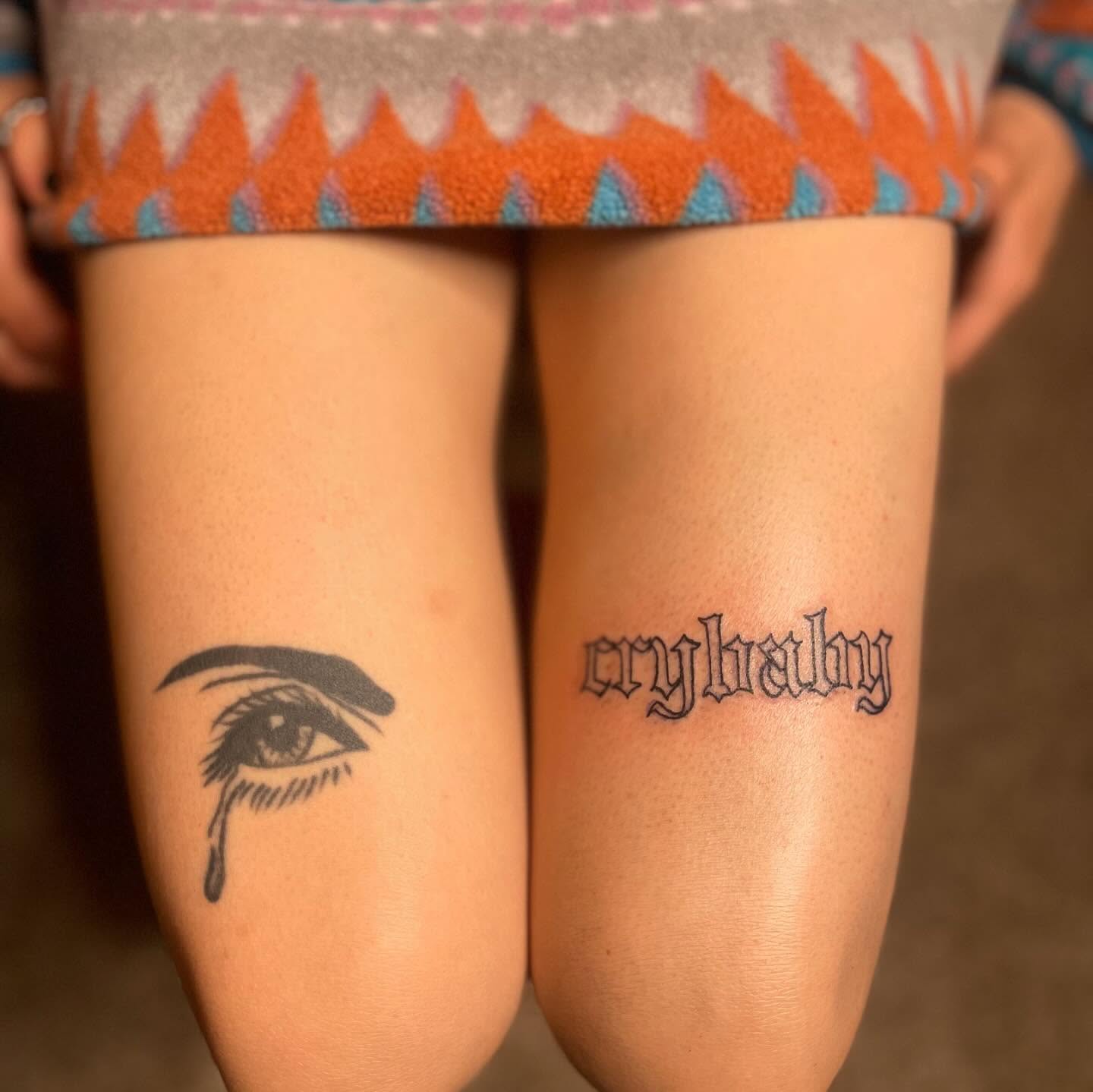 Tearful eye black and grey tattoo on the thigh by Danny Garcia