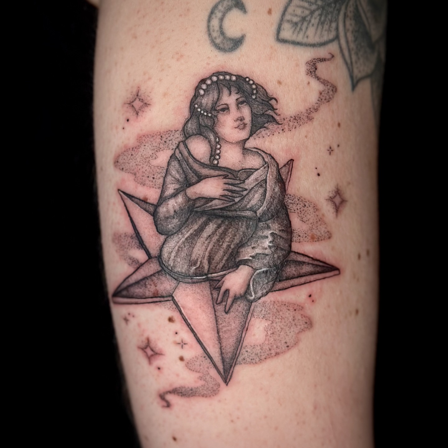 Woman on star dotwork tattoo on the forearm by Sabrina, Harrison, New Jersey