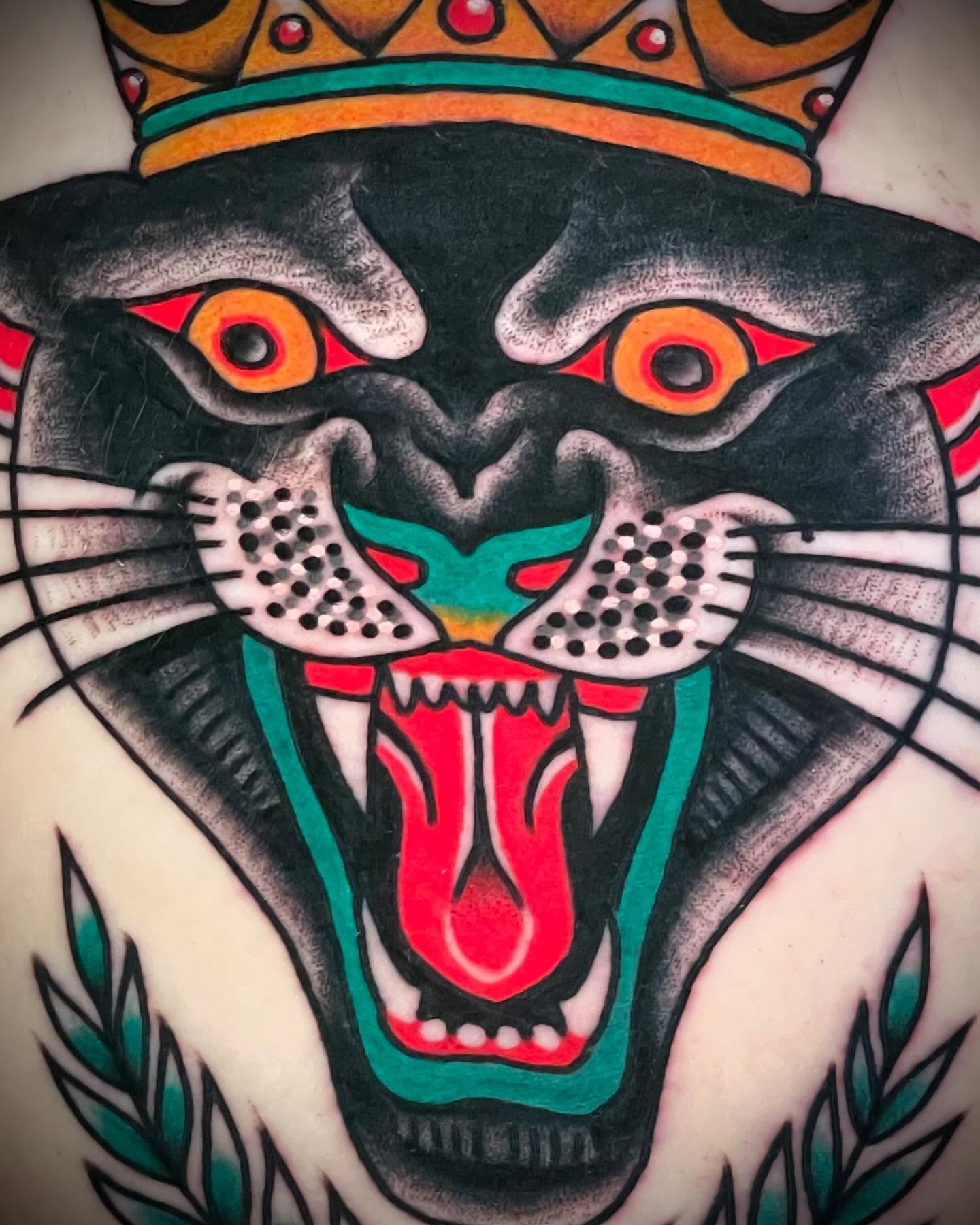 Panther American traditional tattoo on the chest by Alex Muniz