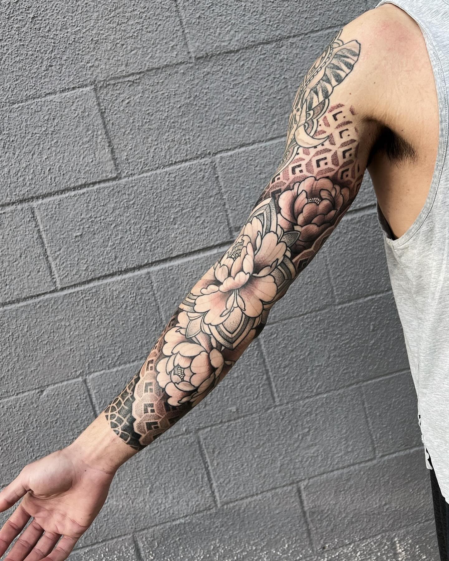 Floral bouquet American traditional tattoo on the forearm by Kyle Olson, Salt Lake City, Utah