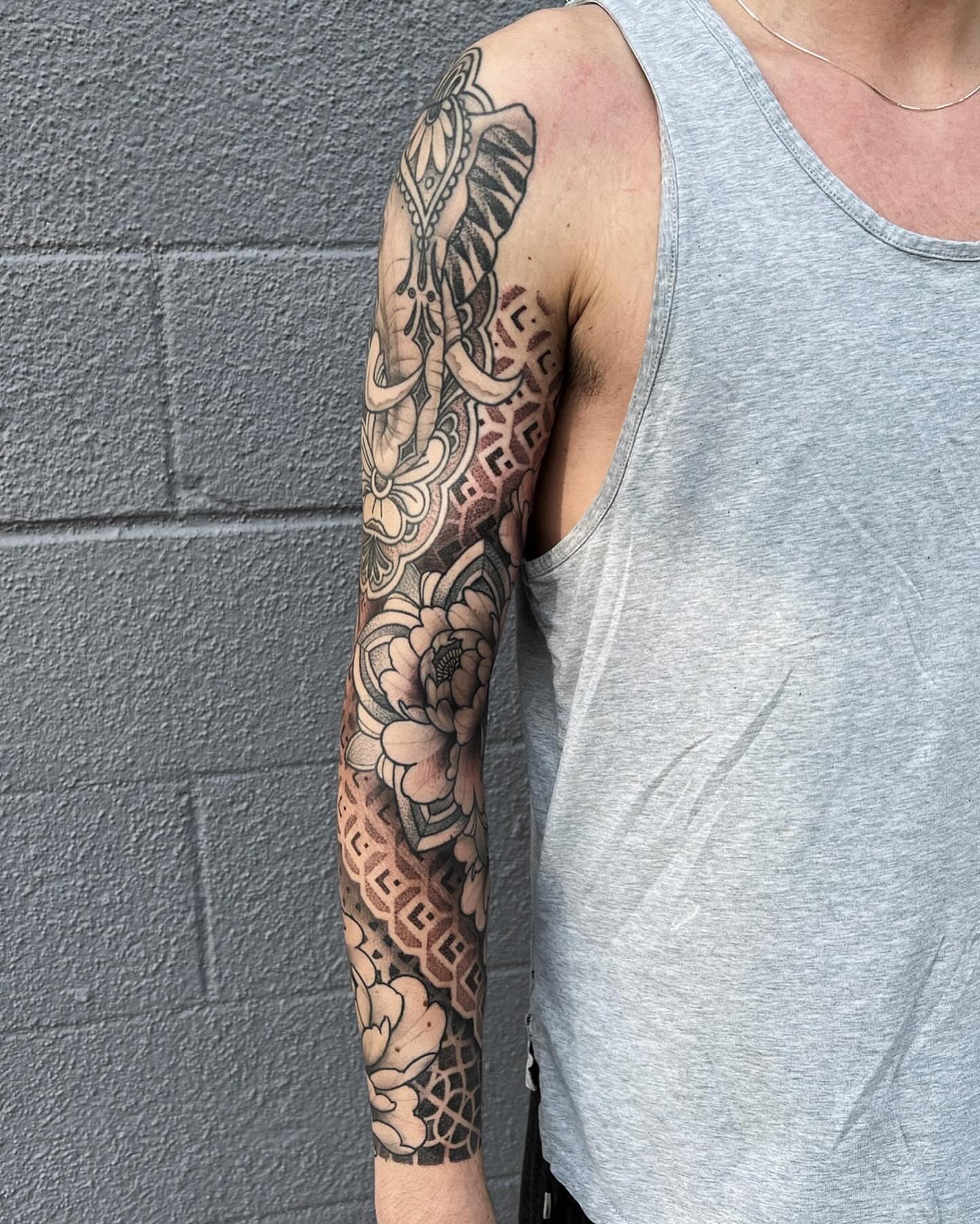 Floral and geometric patterns American traditional tattoo on the forearm by Kyle Olson, Salt Lake City, Utah