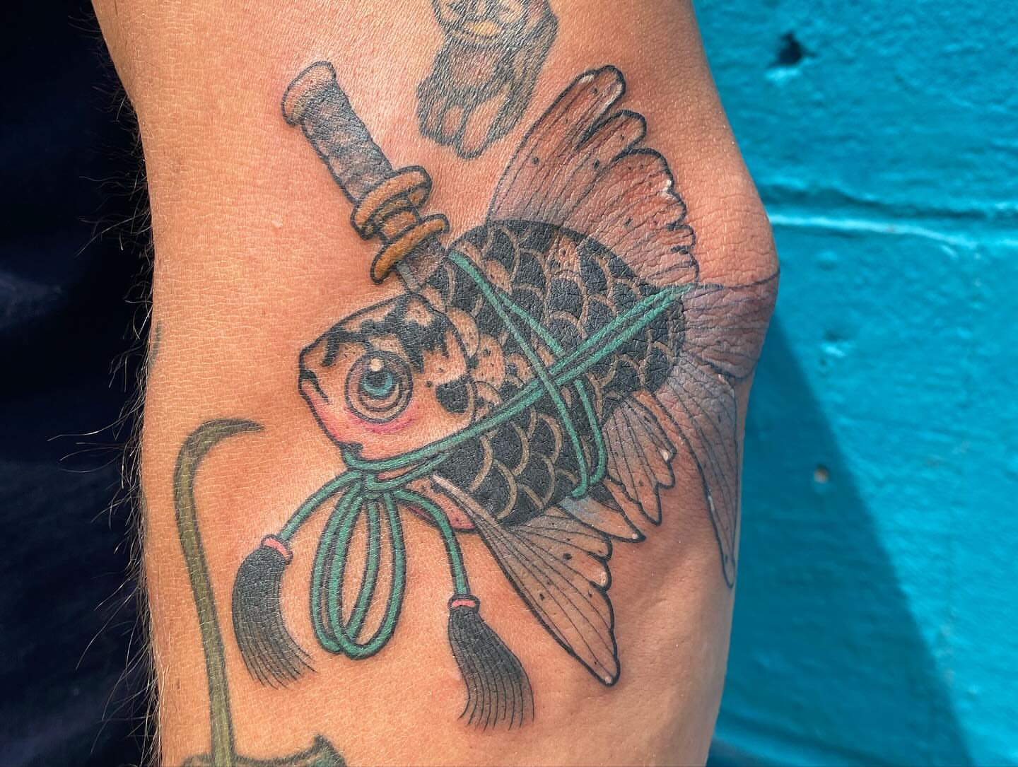Goldfish American traditional tattoo on the forearm by Amber Lea, Kansas City, Kansas