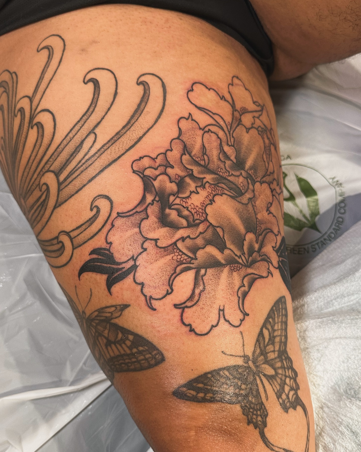 Peony and butterflies American traditional tattoo on the thigh by abigail 🌸