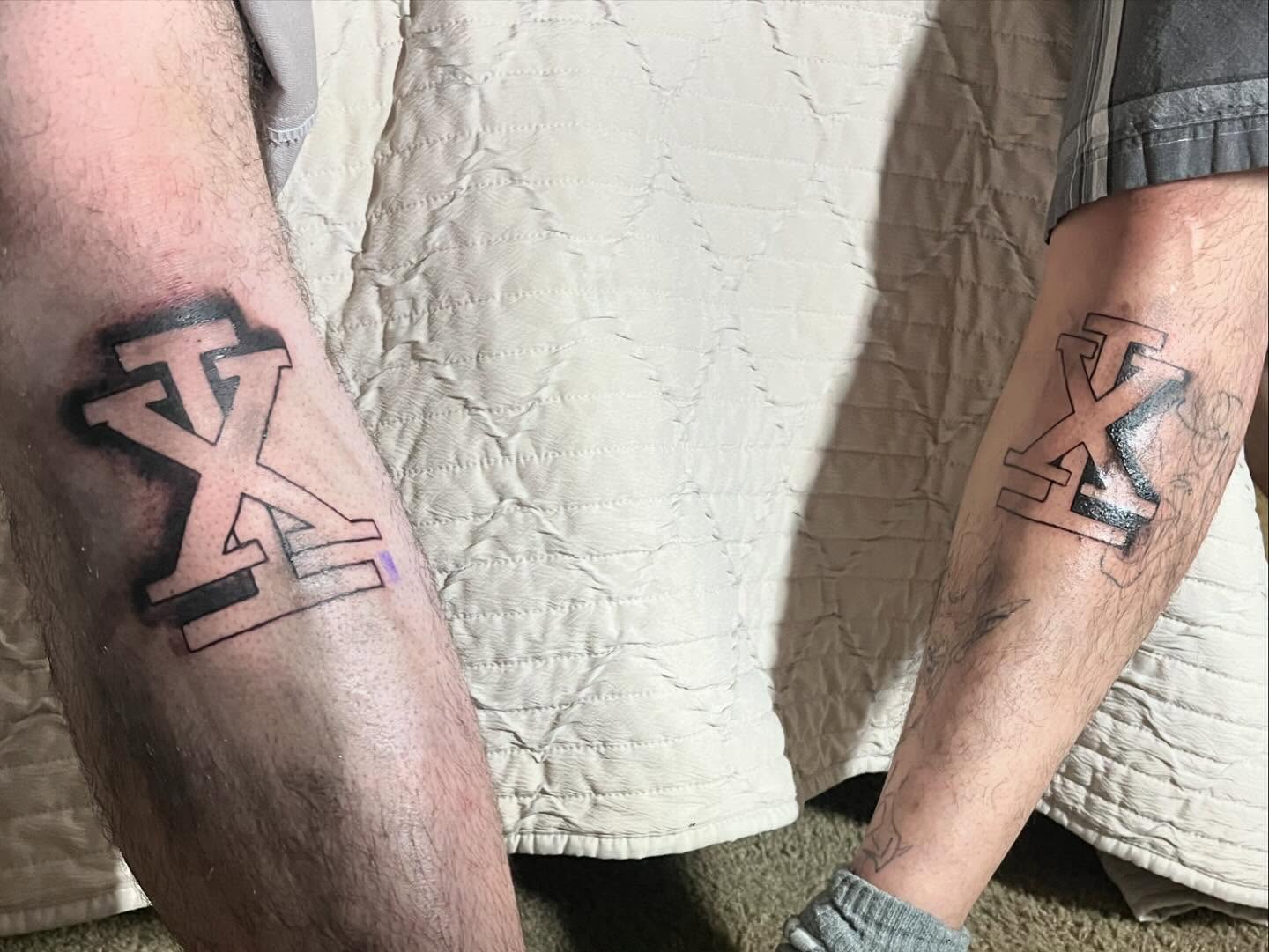 Cross American traditional tattoo on the forearm by Ink_ Hustle36