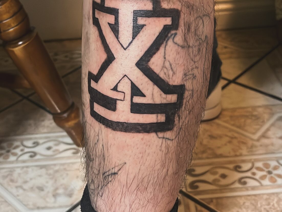 Cross black and grey tattoo on the forearm by Ink_ Hustle36