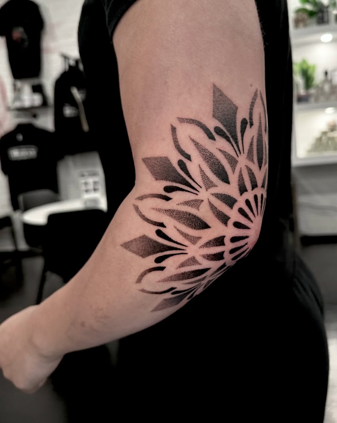 Tattoo by @dayana_tattooartist — dotwork, geometric