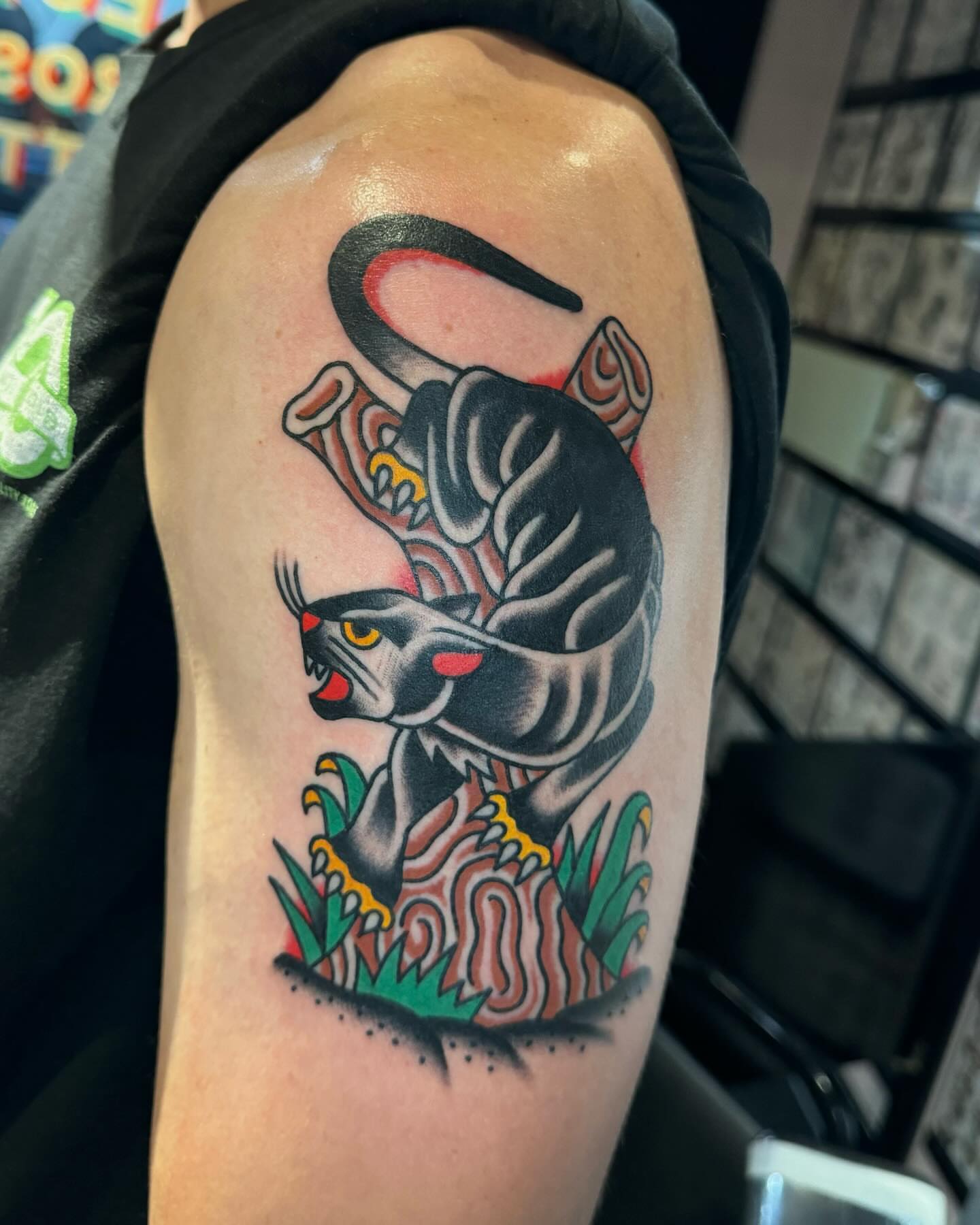 Panther American traditional tattoo on the upper arm by James Shepherd, Austin, Texas