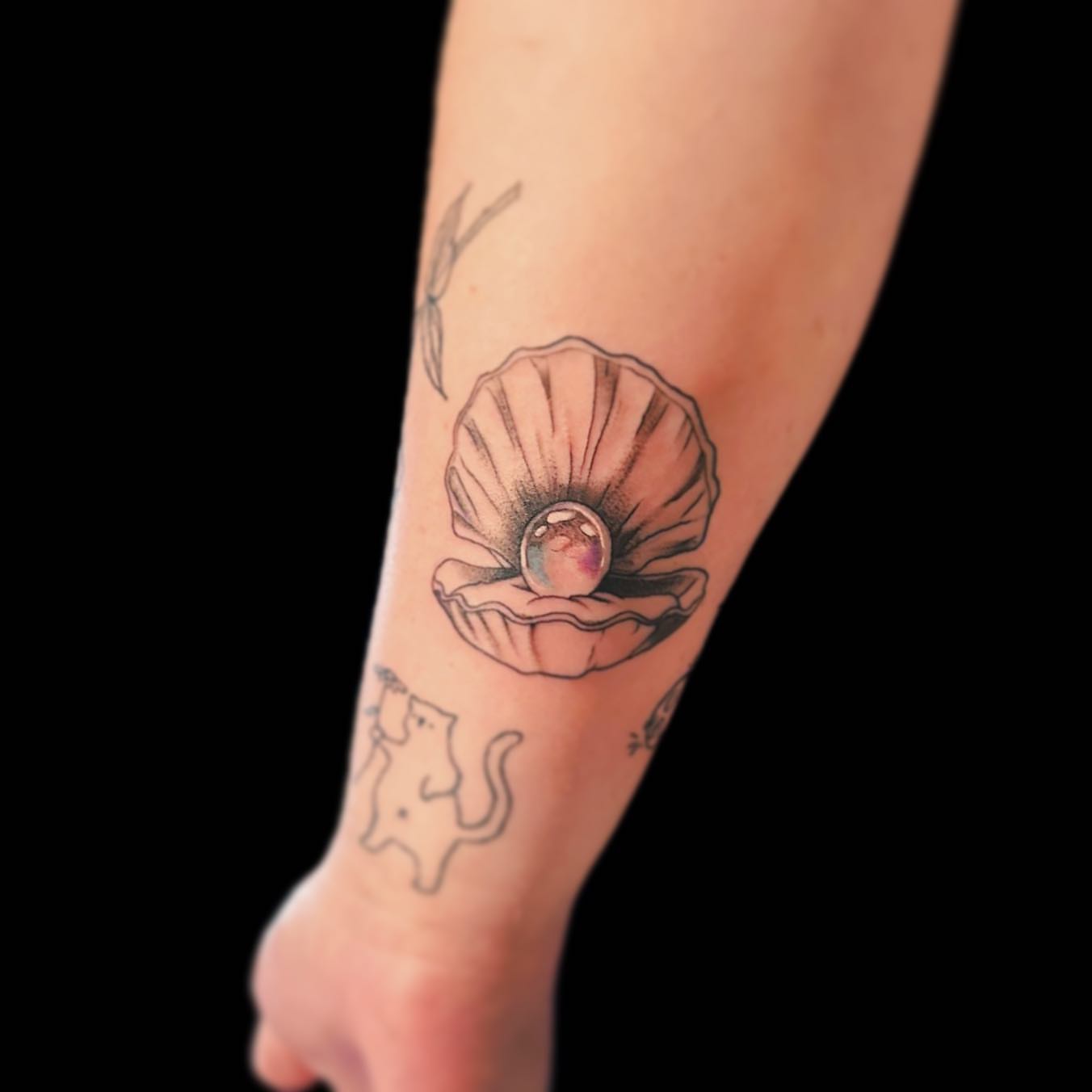Shell with pearl watercolor tattoo on the forearm by โงโ โฑ โพ ๐ณ๐๐๐๐๐ โฆ โฑ โโง