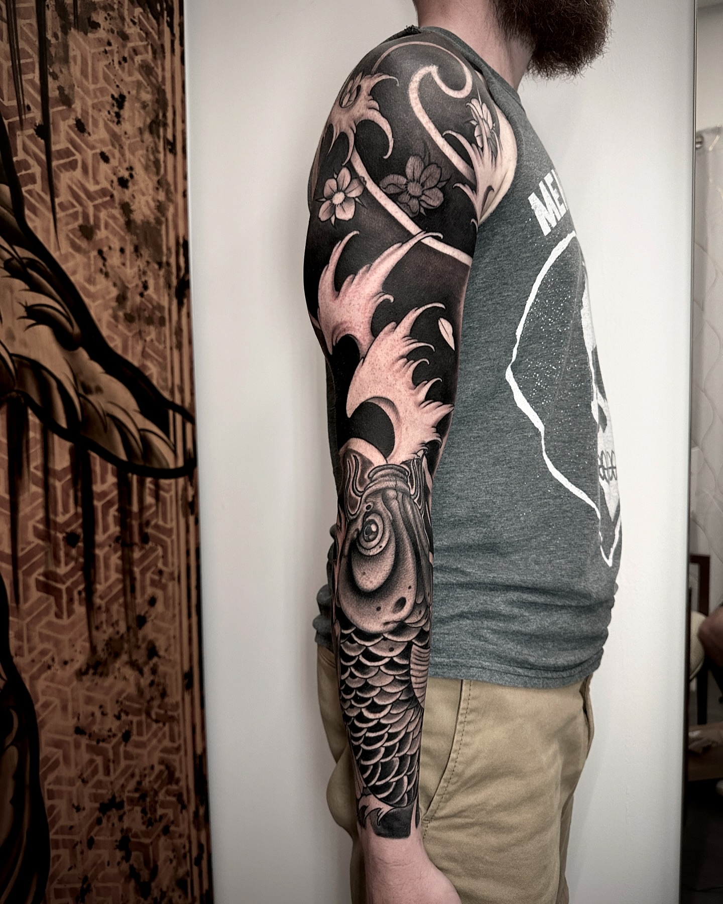 Koi fish realism tattoo on the upper arm by Ty Pallotta, Austin, Texas