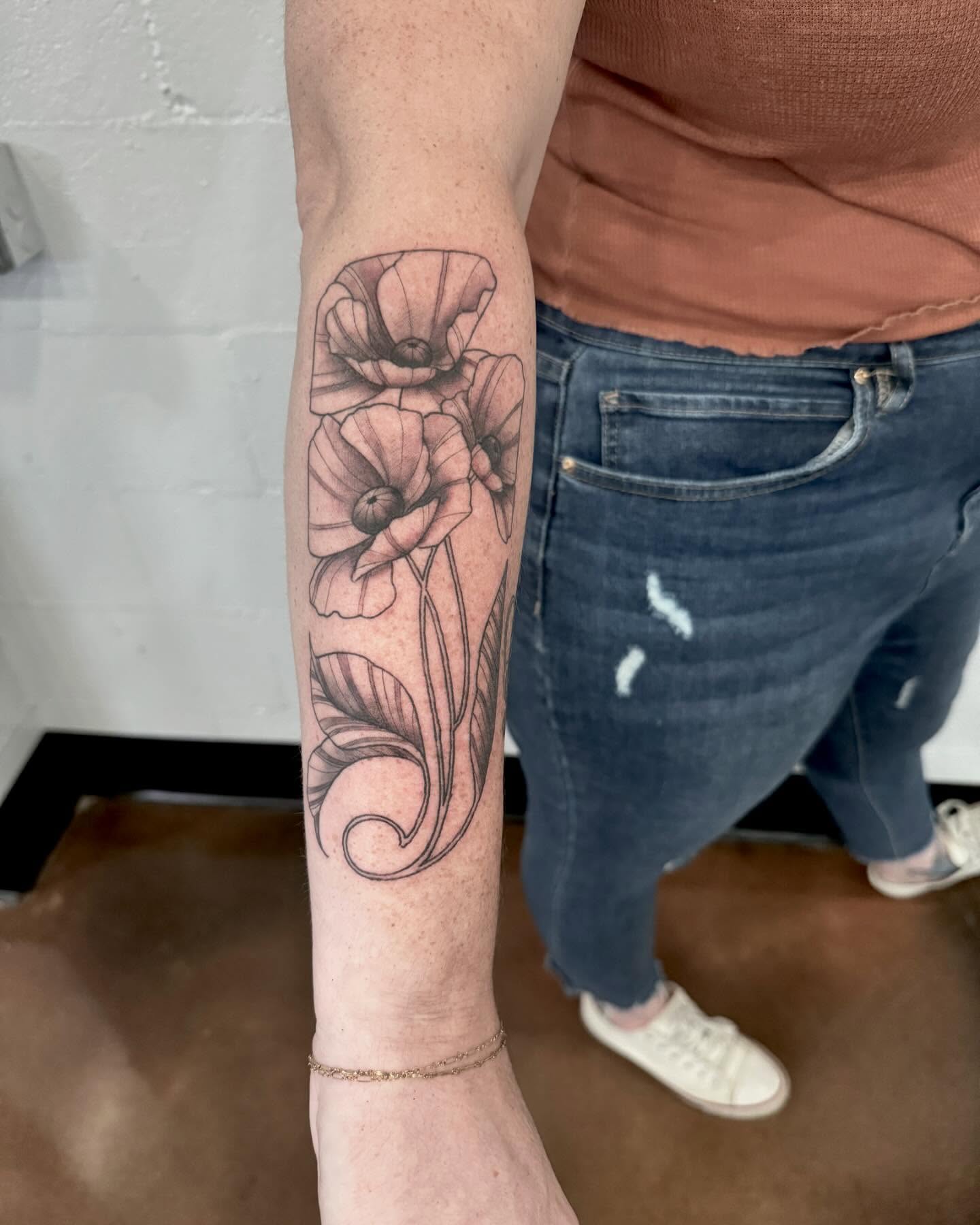 Poppy flowers black and grey tattoo on the forearm by Drew Foster, Toledo, Ohio