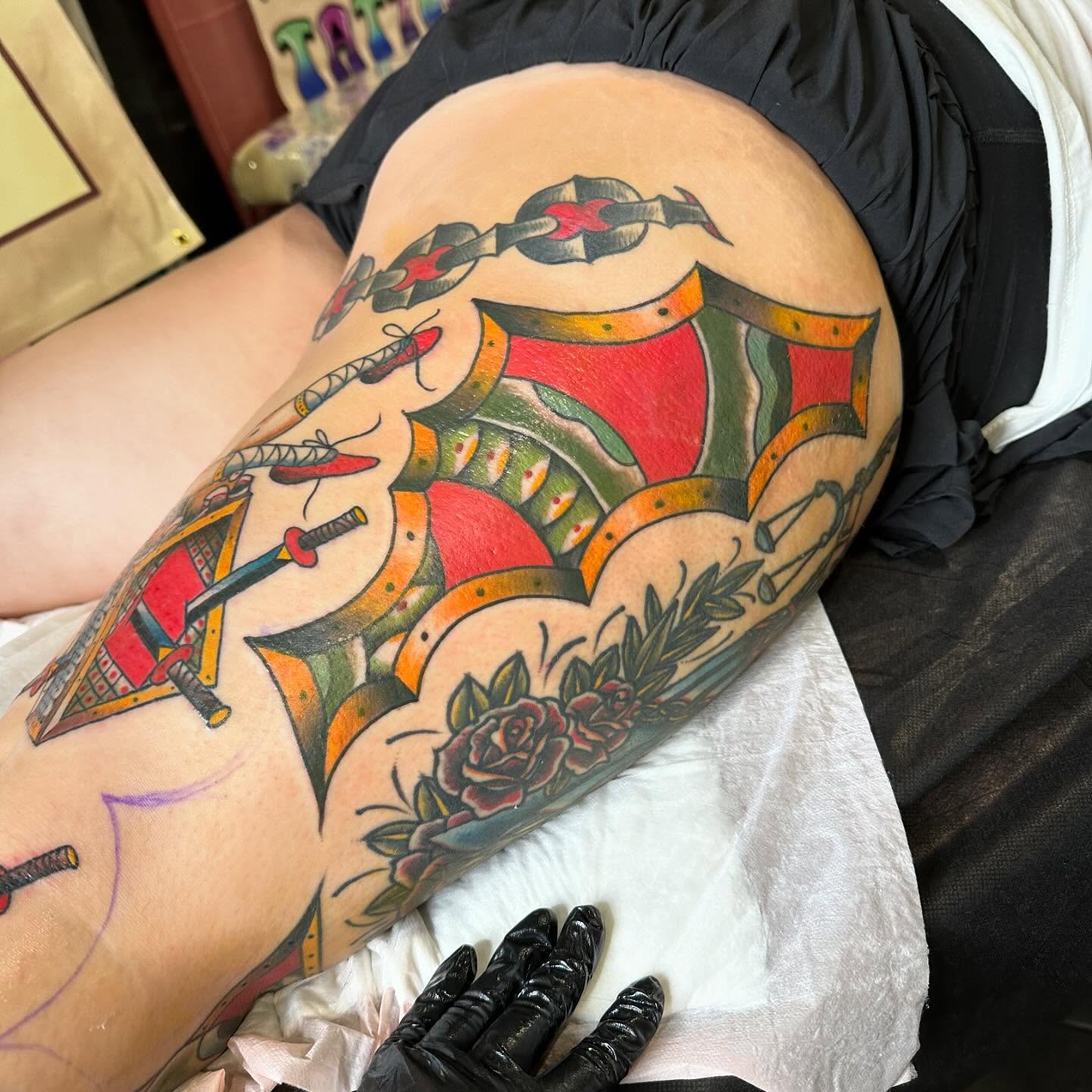 Chain and shield American traditional tattoo on the thigh by Jenni Hand - Tattoo, Maryville, Tennessee
