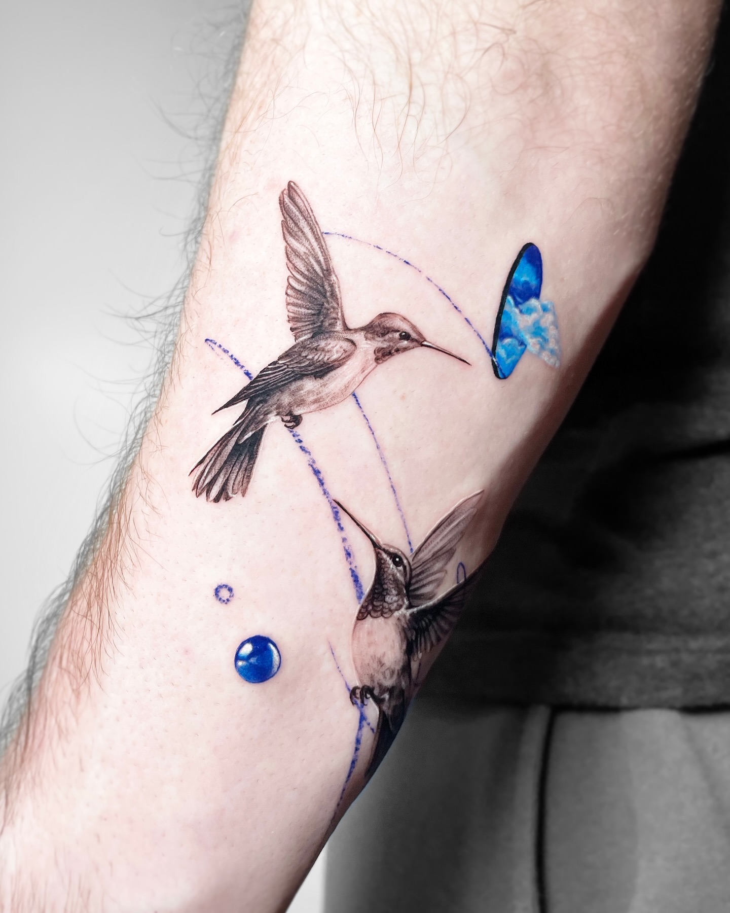 Hummingbirds realism tattoo on the forearm by Yeye