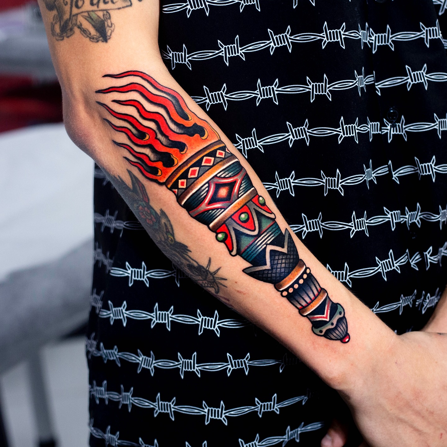 Flame and dagger American traditional tattoo on the forearm by Miguel Comin