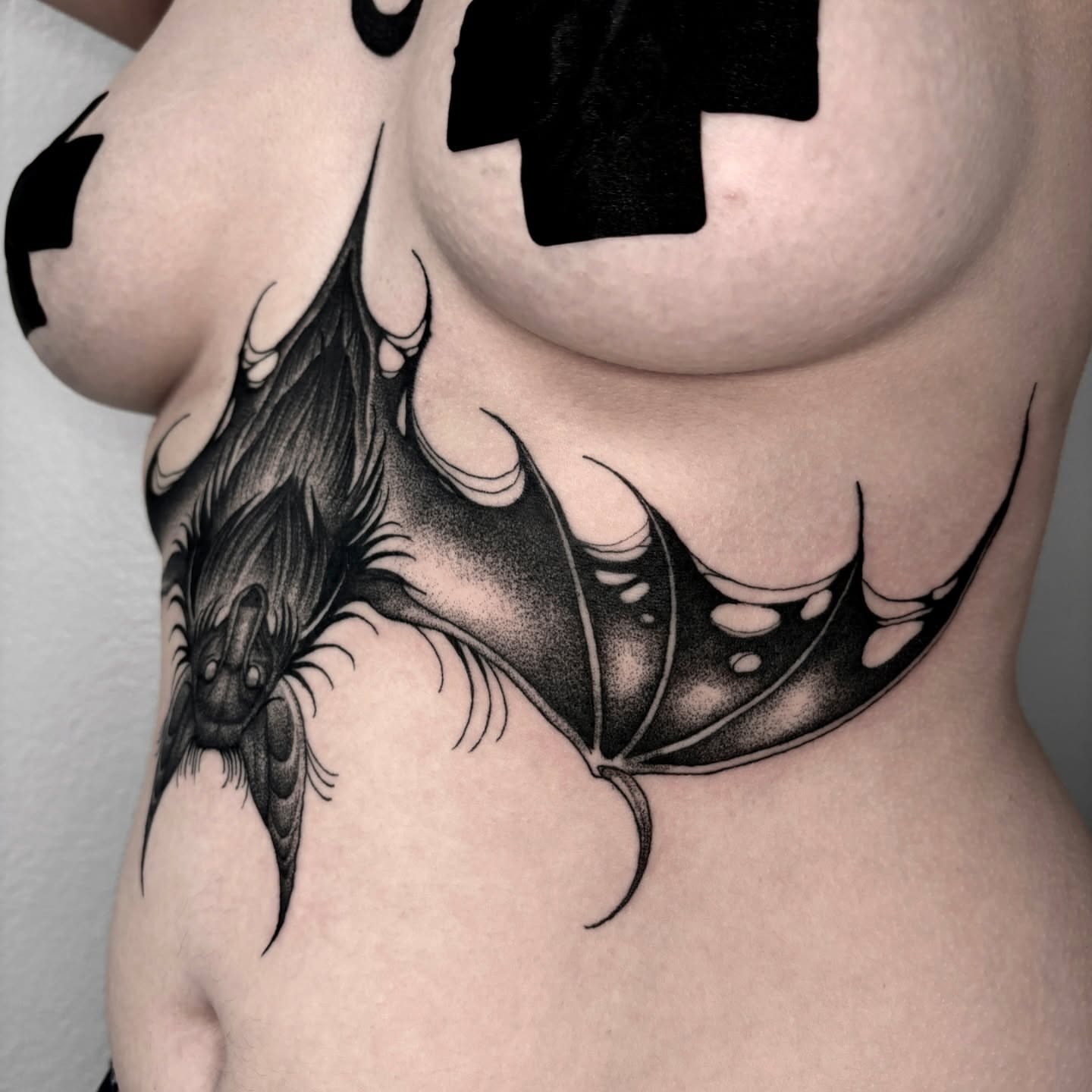 Bat black and grey tattoo on the ribs by Jens