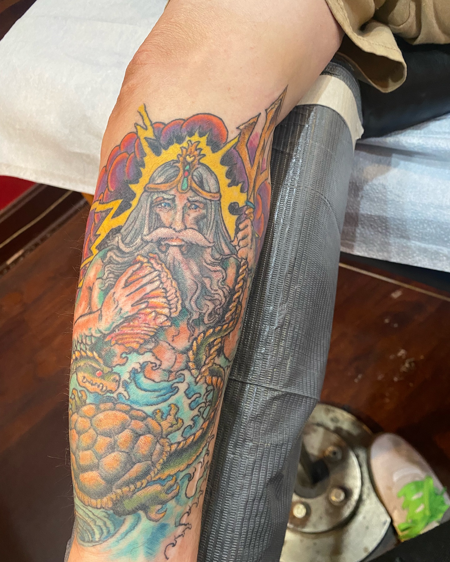 Wizard and dragon American traditional tattoo on the forearm by Christopher Sanders