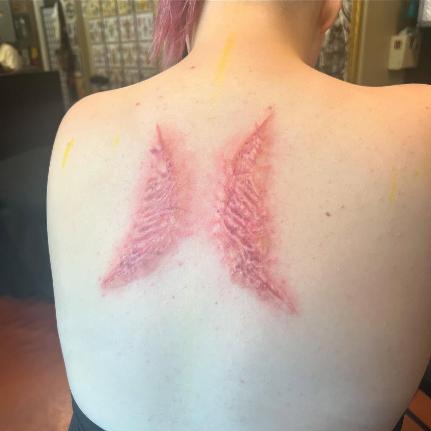 Wings neo-traditional tattoo on the back by SJ Horvath