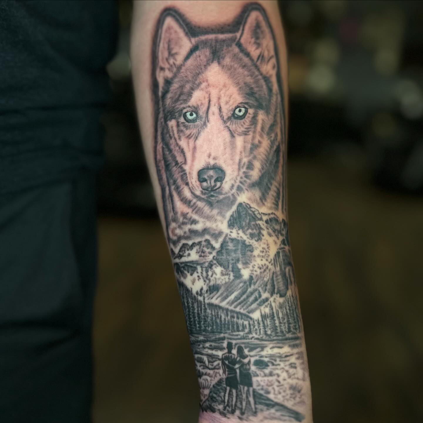Wolf and couple realism tattoo on the forearm by Ohio Realism Tattoo Artist