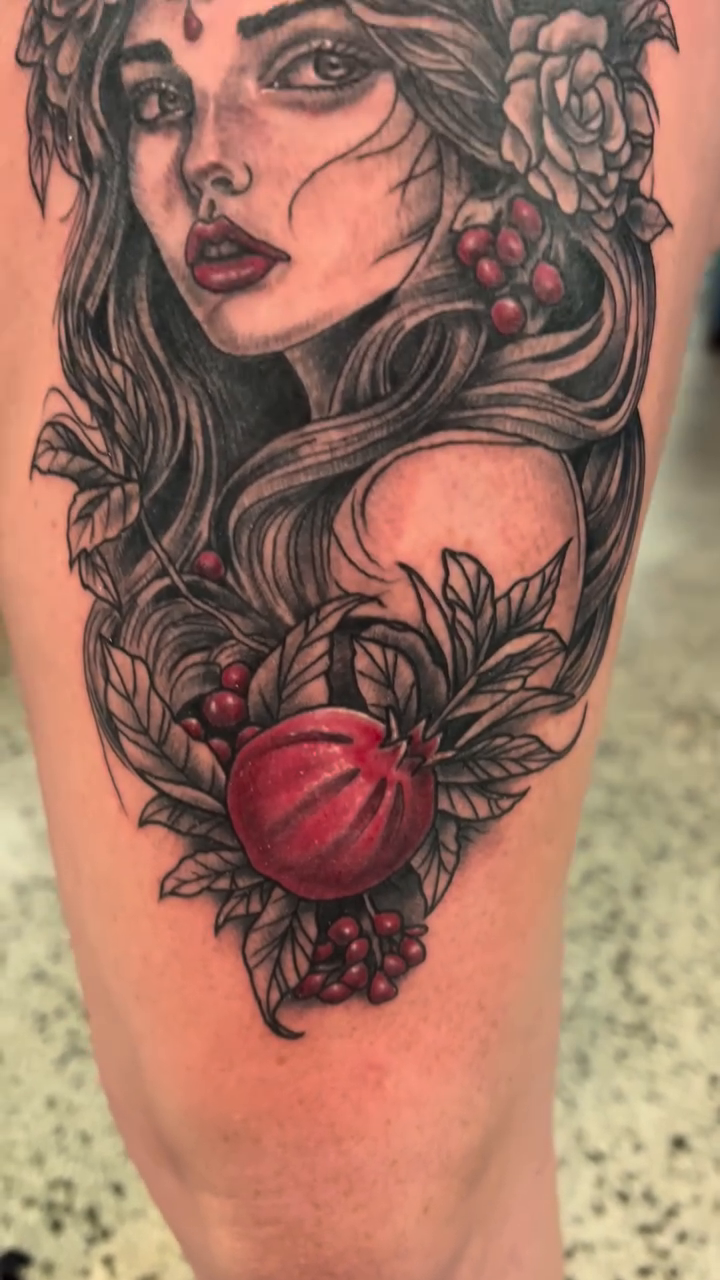 Woman with fruit and foliage realism tattoo by Krys King Tattoos