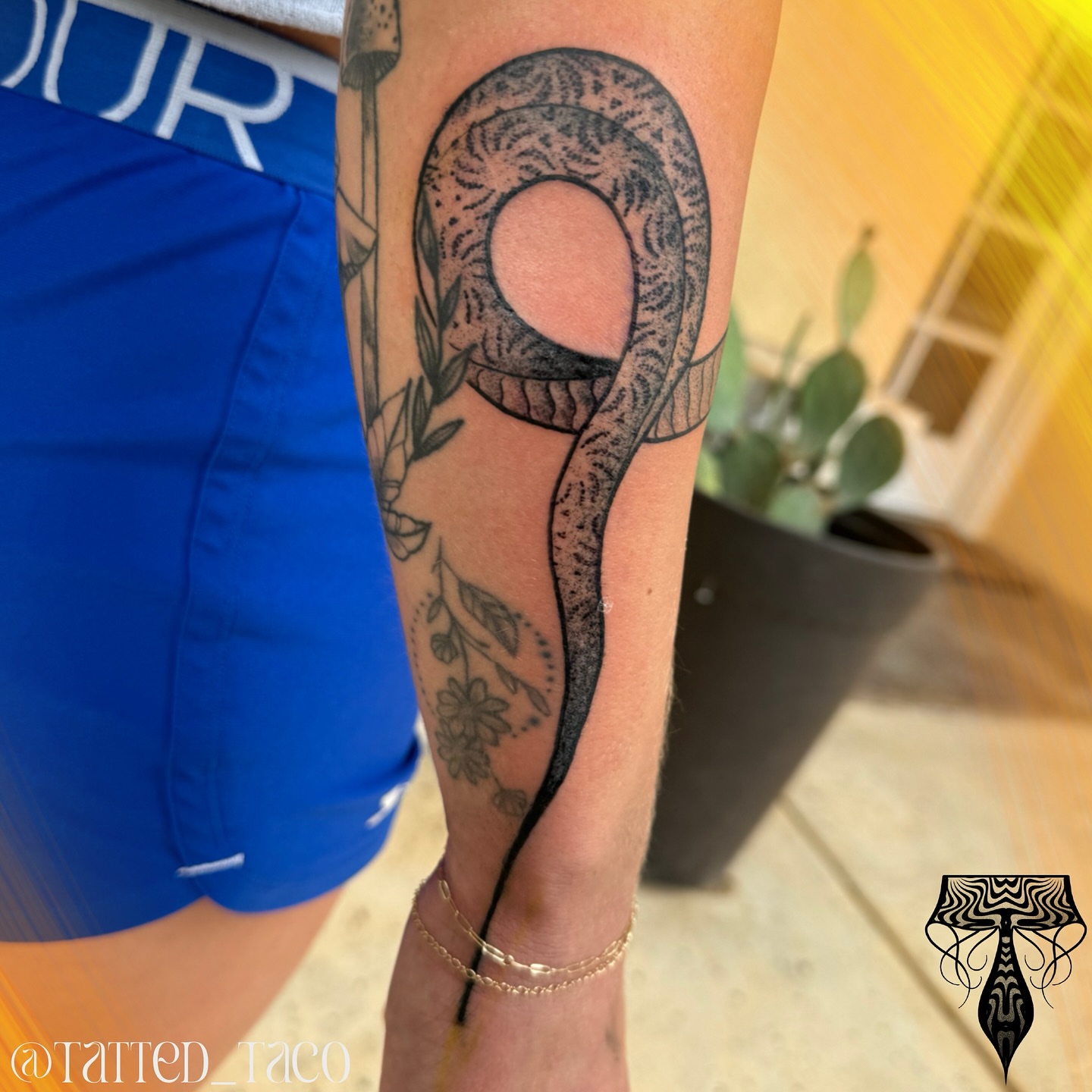 Snake black and grey tattoo on the forearm by Ray Arce๐