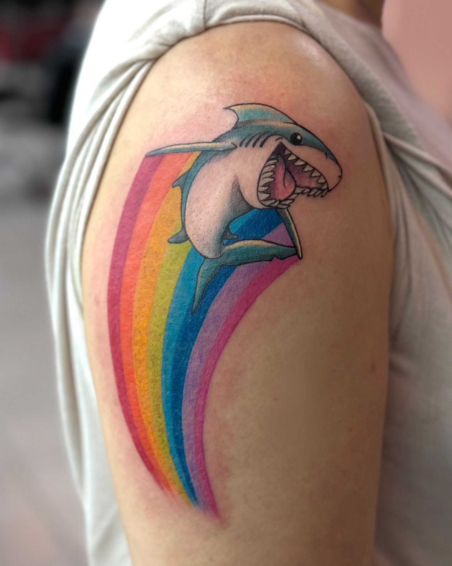 Shark with rainbow new school tattoo on the shoulder by Hailey K - Arizona Tattoo Artist, Miami, Florida