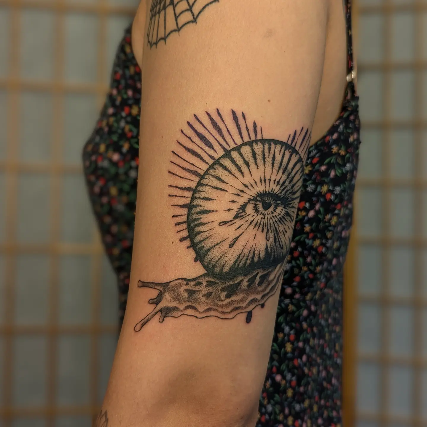 Snail shell dotwork tattoo on the forearm by Jeanine, Providence, Rhode Island