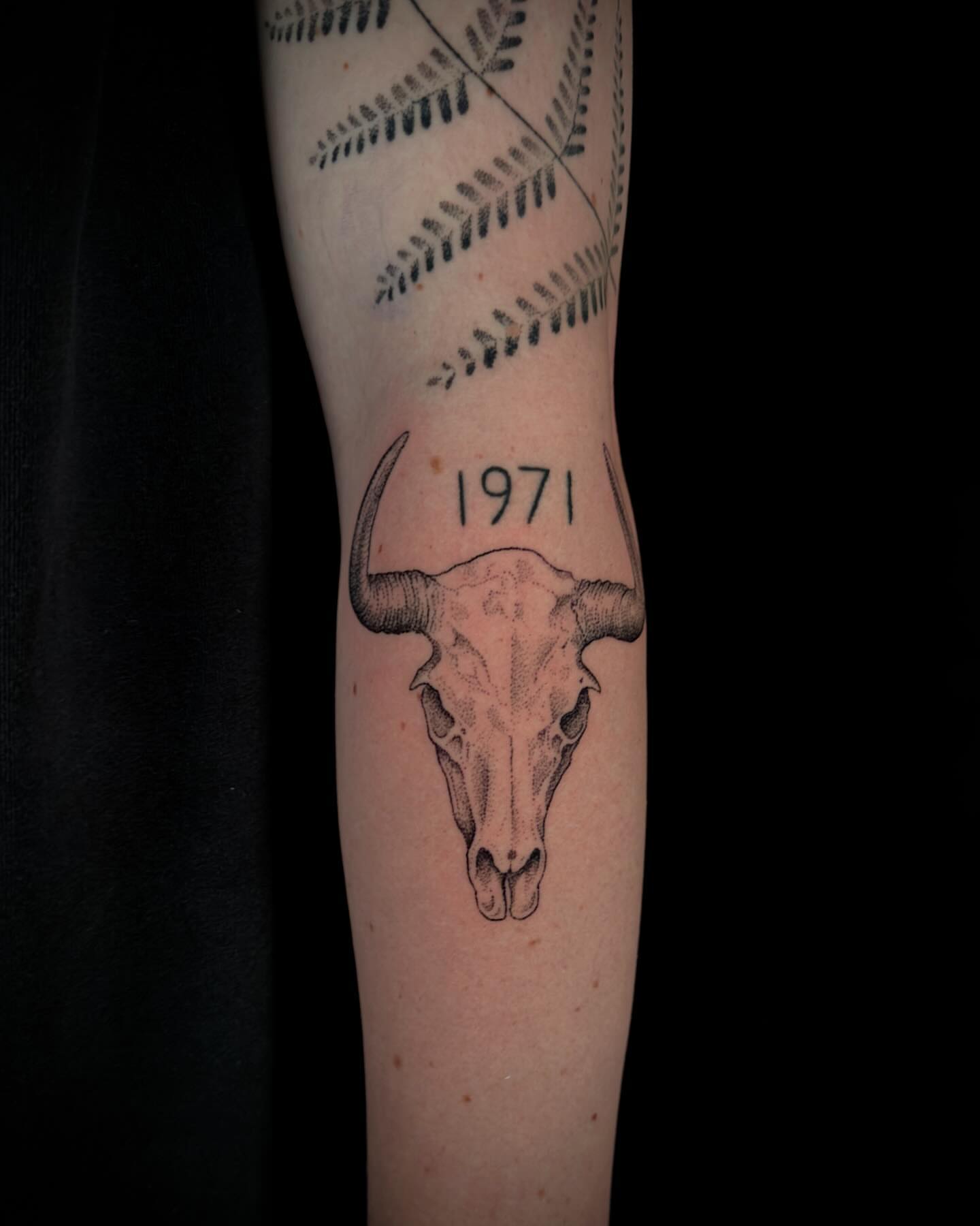 Bull skull black and grey tattoo on the forearm by Chelsey