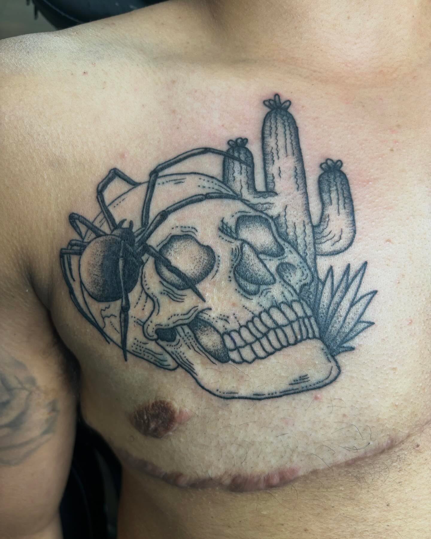 Skull with cactus and spider dotwork tattoo on the chest by Bryan Black