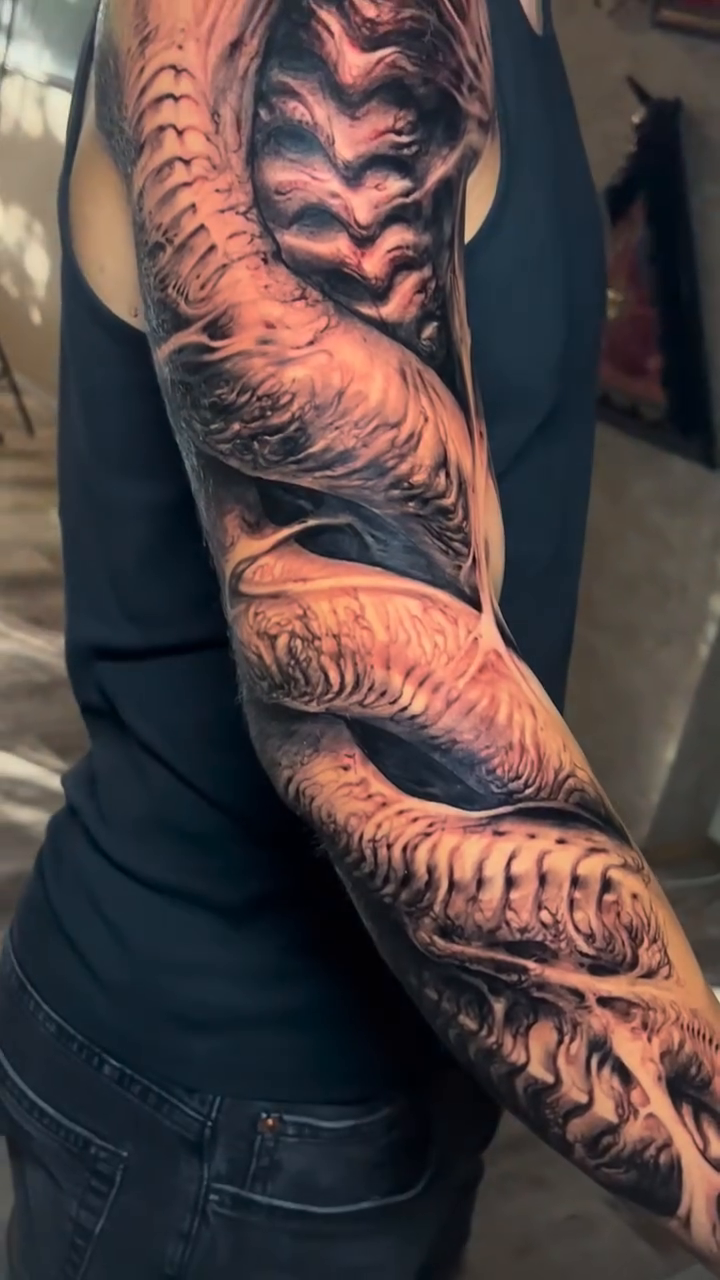 Biomechanical arm sleeve realism tattoo by David Jorquera