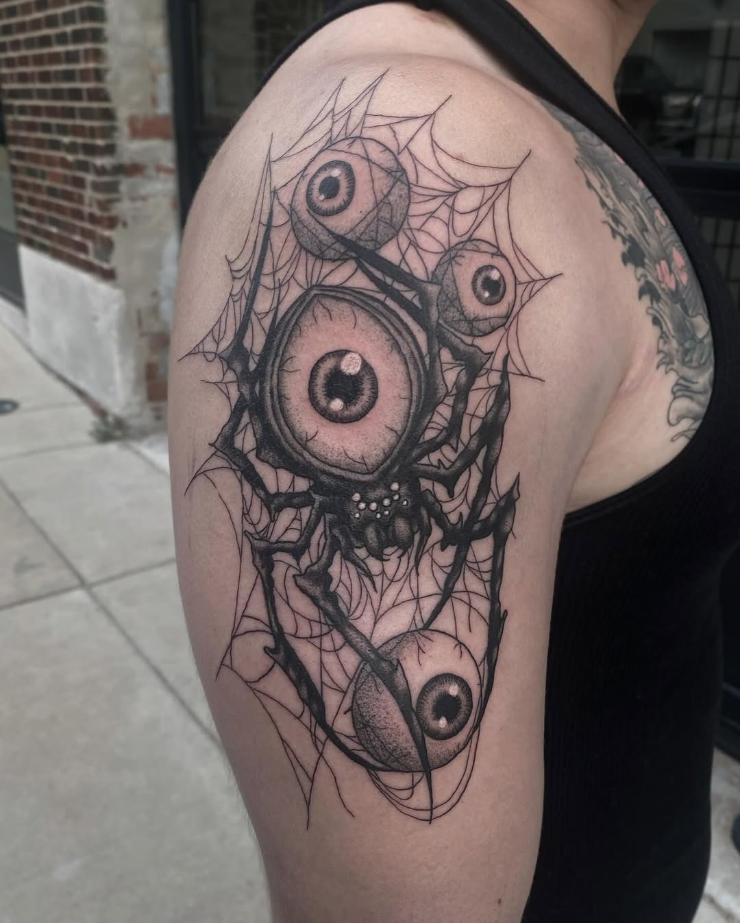 Spider with eyeballs and web sketch tattoo on the shoulder by Damon 🥀