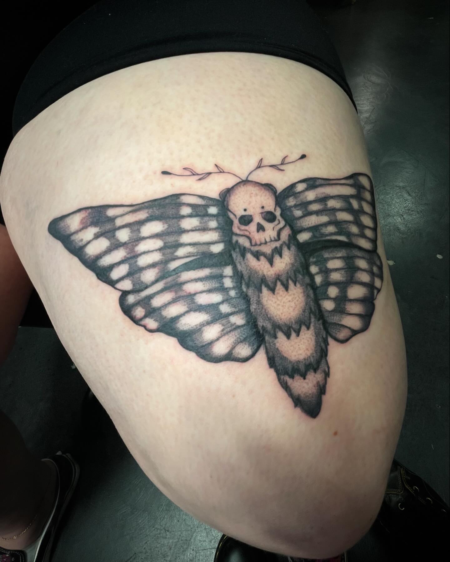 Butterfly with skull realism tattoo on the thigh by ⊹ * . 𝕵az ⊹ * .