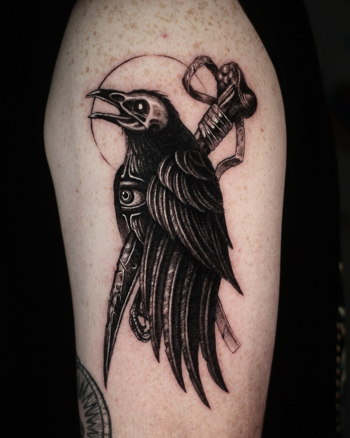 Crow black and grey tattoo on the forearm by H.black