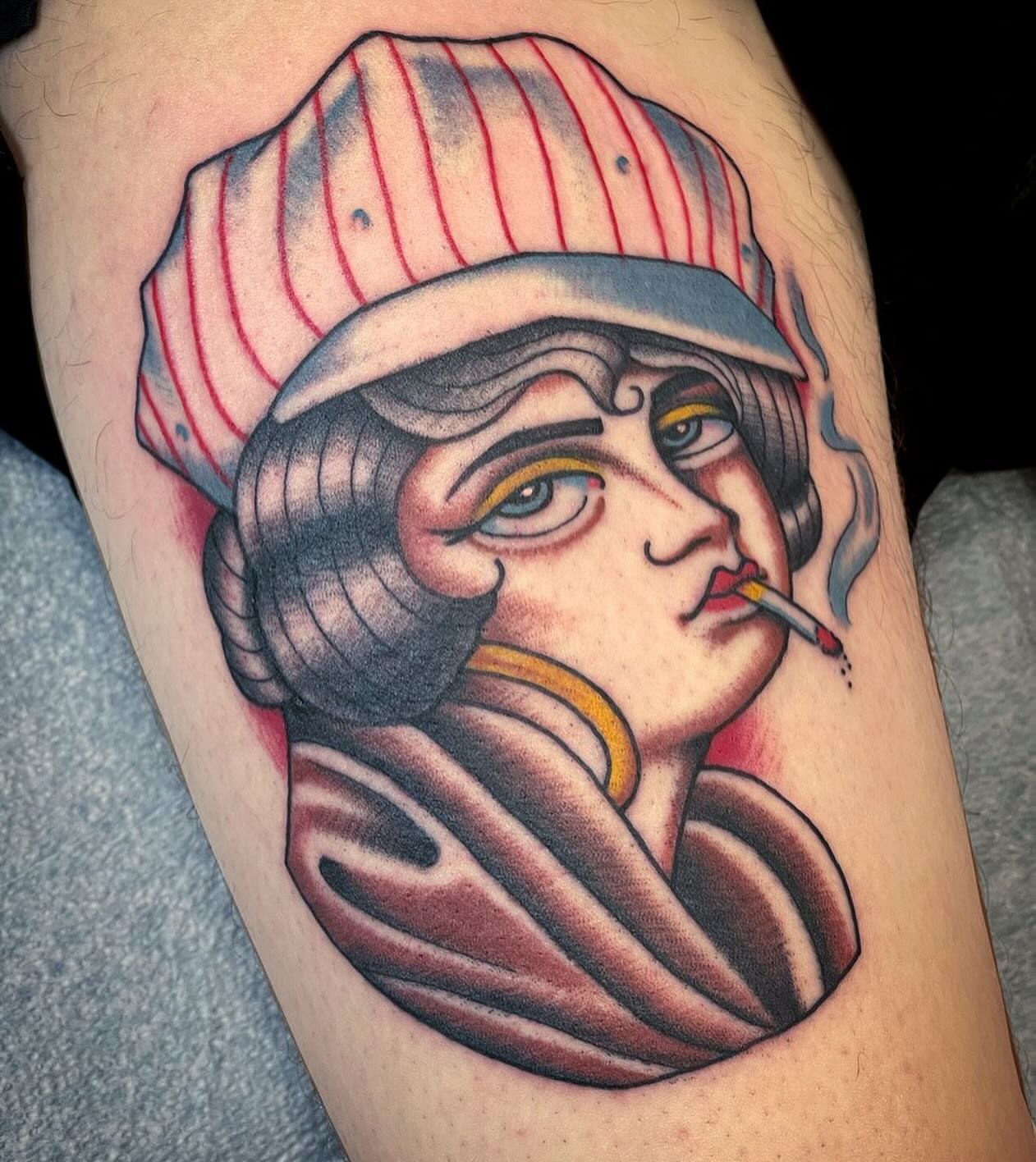 Woman smoking American traditional tattoo on the thigh by Dave Shurman