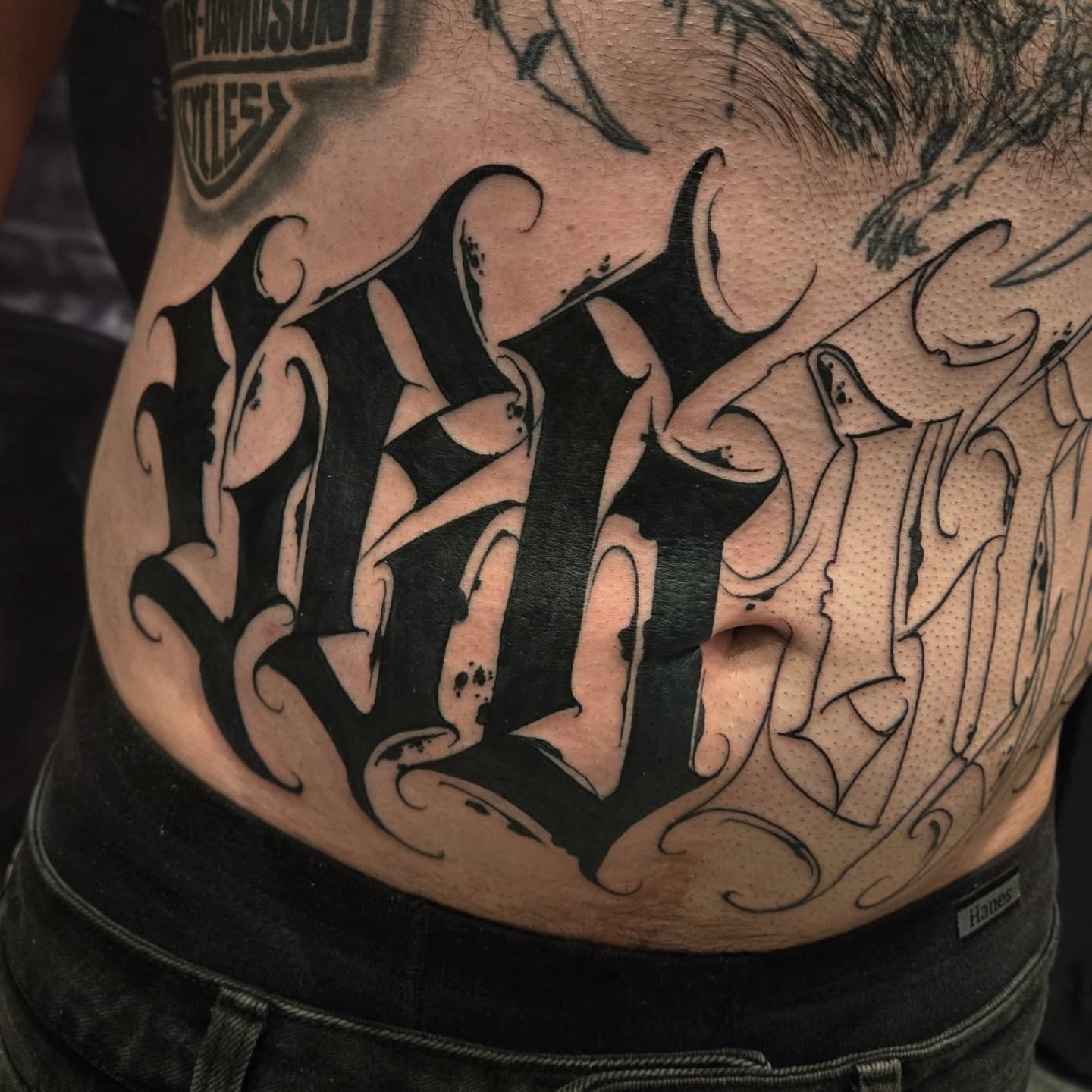 Script lettering lettering script tattoo on the torso by DiazTattoos, Denver, Colorado