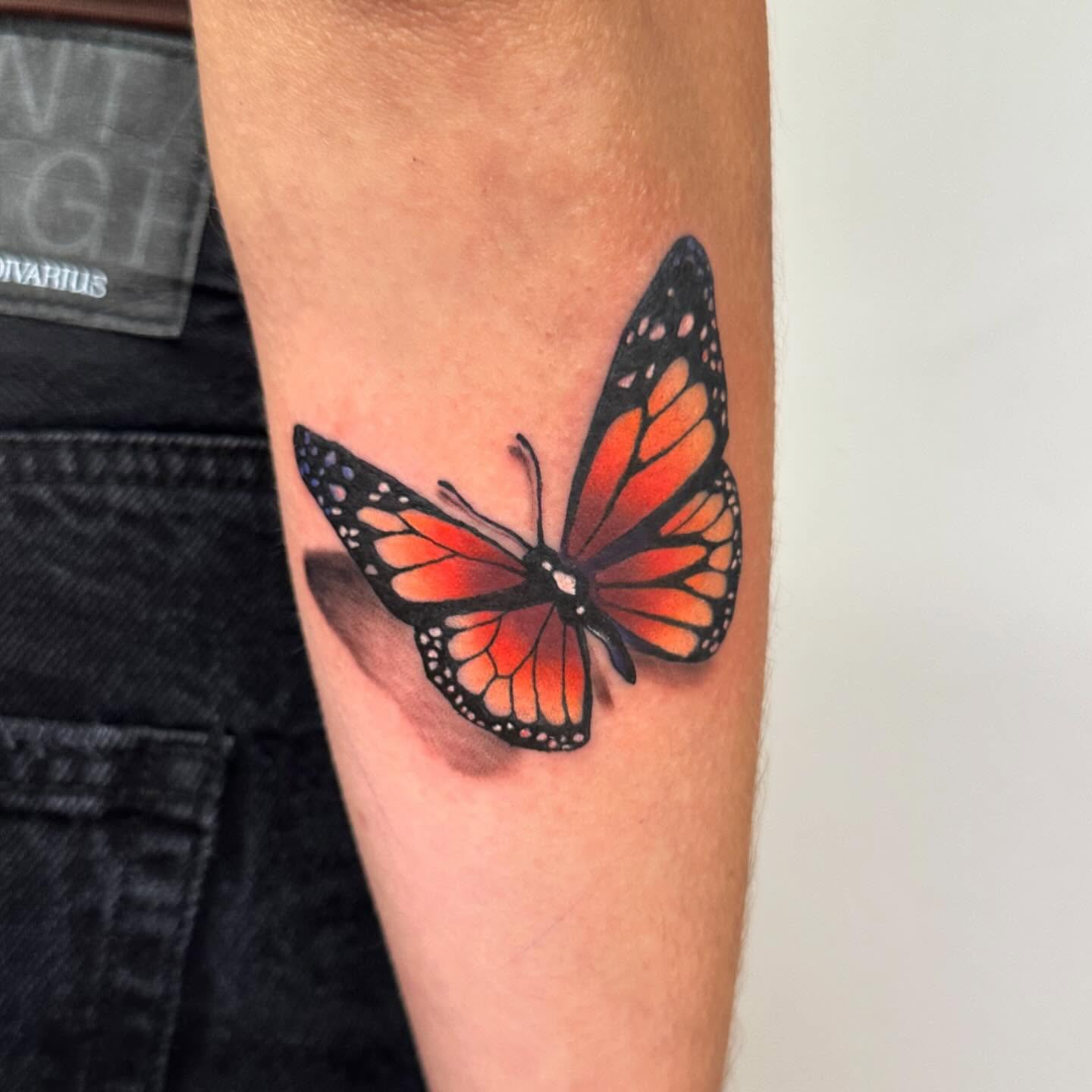 Monarch butterfly realism tattoo on the forearm by ⠀Joey Rosado