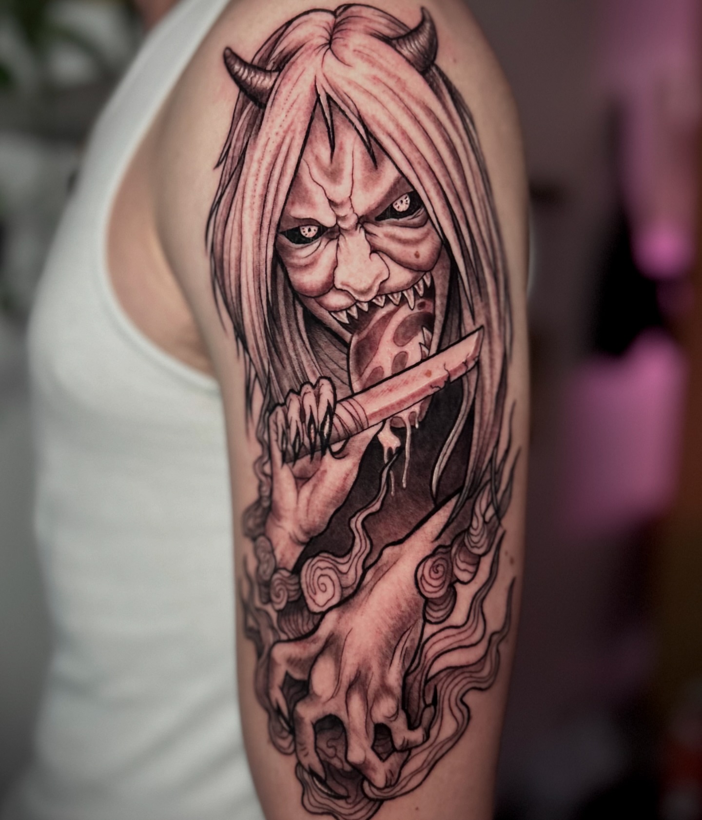 Demon with knife dark realism tattoo on the forearm by Bradi