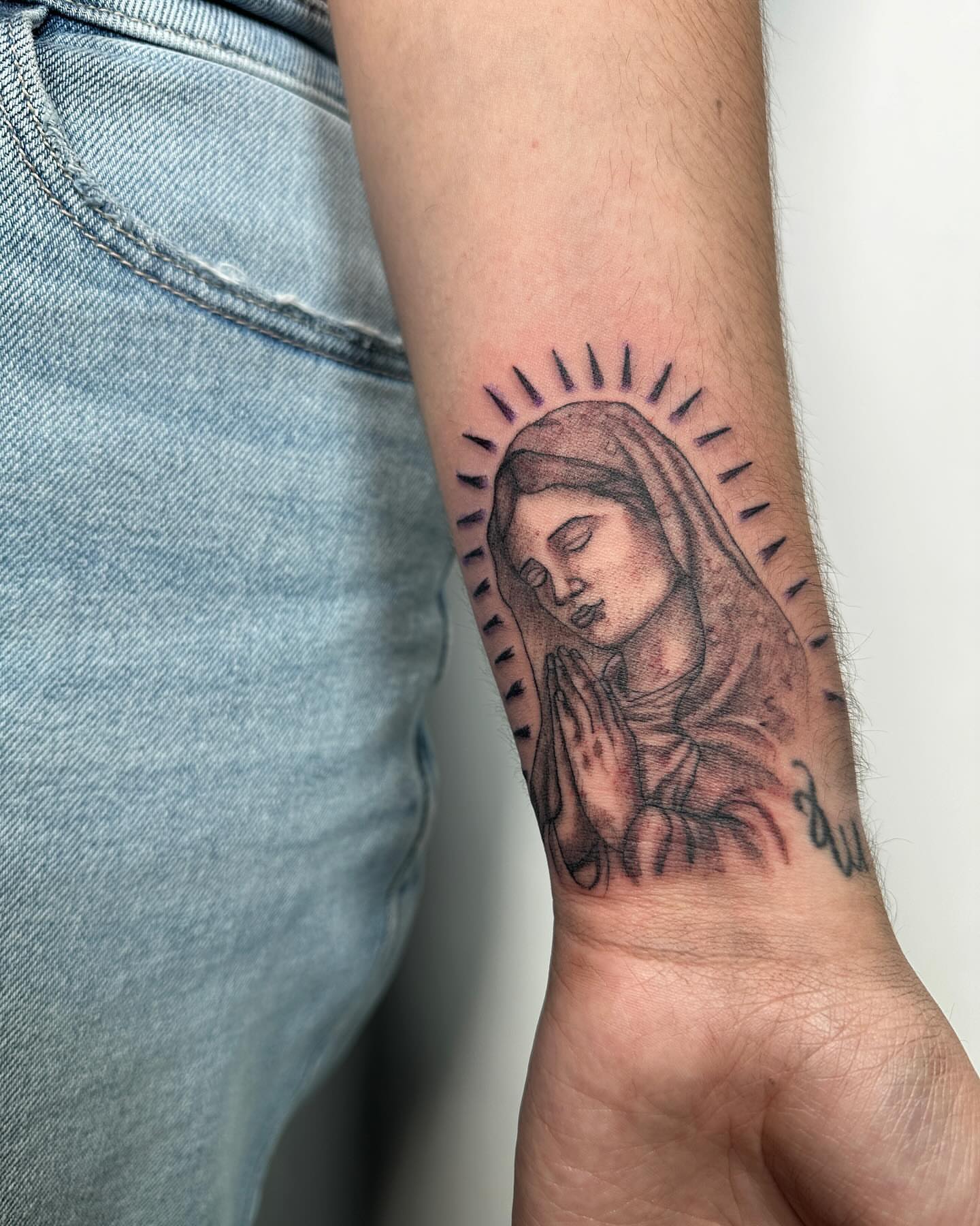 Praying woman realism tattoo on the forearm by San Diego Tattoo Artist
