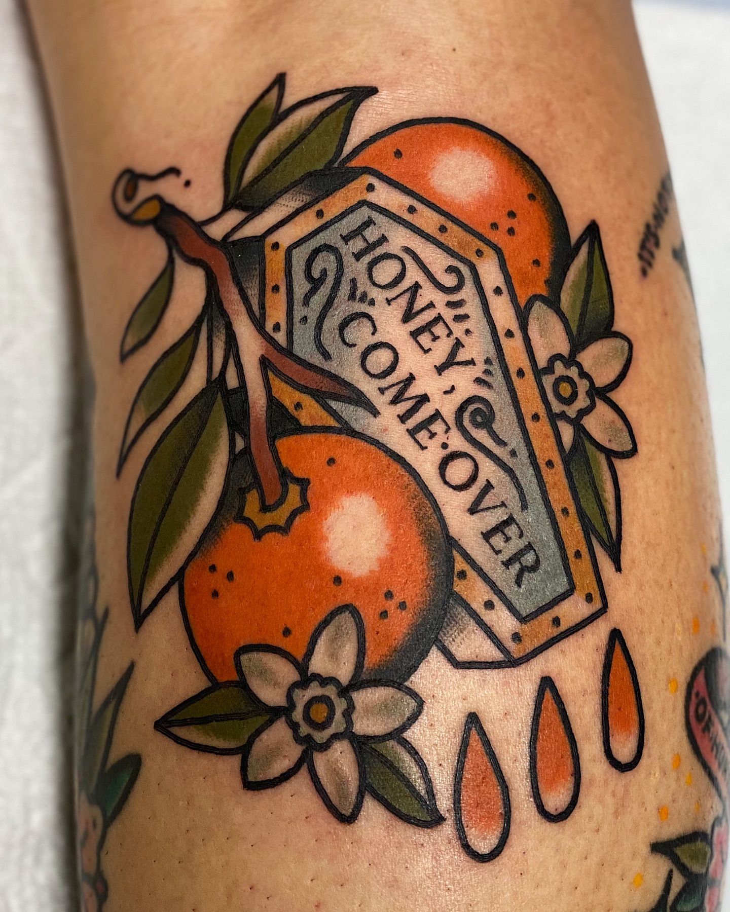 Orange and honey sign American traditional tattoo on the forearm by Dakota Amato