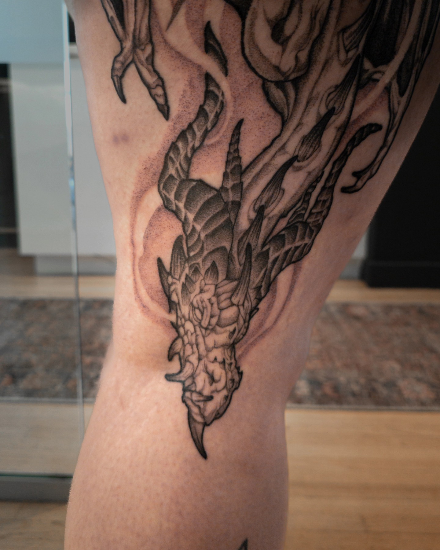 Dragon realism tattoo on the thigh by EyeSee Tattoos